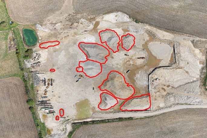 Quarry-overview-with-stockpiles-highlighted Stockpiles are highlighted to determine volume.